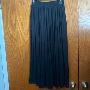 Long black pleated skirt